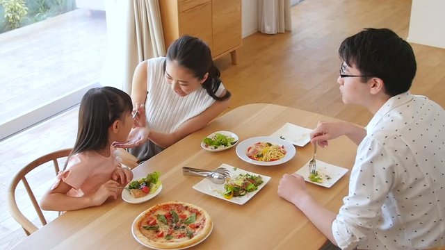 Family eating meal together, Tokyo, Japan