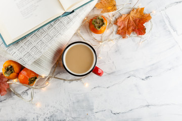 Autumn light still life with coffee and book
