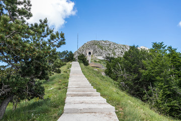Fototapeta na wymiar Spectacular view wirh stone steps in Mountains in Lovcen National park in Montenegro