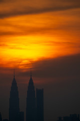 Naklejka premium Cloudy sunset view over down town Kuala Lumpur, Malaysia.