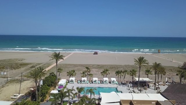 Almeria, Spain holiday resort pool next to seaside, aerial view
