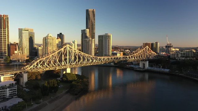 Brisbane city sunrise beautiful aerial with CBD, Brisbane river, buildings, Story Bridge and highway with numbers of cars