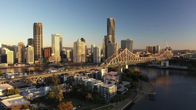 Panoramic Brisbane city sunrise beautiful aerial with CBD, Brisbane river, buildings, Story Bridge and Howard