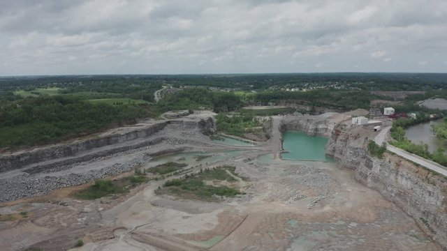 Drone flies over a quarry in the Midwest USA.  in summer, in 4K.
