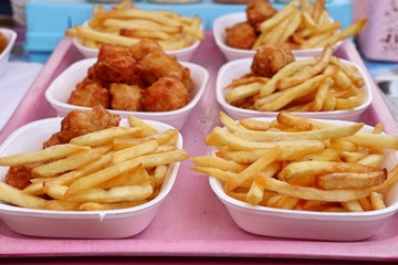 French fries and fried chicken at market