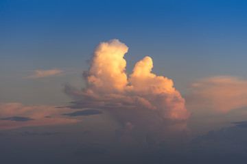 Evening sky with dramatic clouds over the sea with sculpted 3D cloudscape.