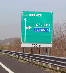 big highway signs with italian text with name of city