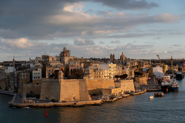 Fototapeta premium view of the urban landscape and the port of marseille at sunset