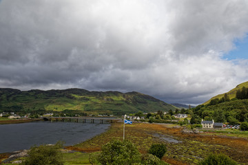 Scottish flag over the Highlands montains - Scotland, UK