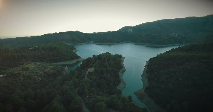 Spanish mountain lake in beautiful sunset - footage is graded with a light teal and orange m31 LUT.