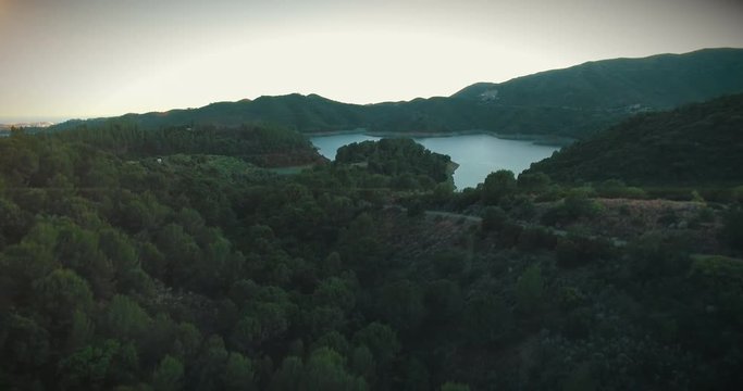 Spanish mountain lake in beautiful sunset - footage is graded with a light teal and orange m31 LUT.