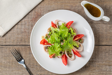 Salad of squid, mushrooms, and vegetables. The view from the top. Copy-space.