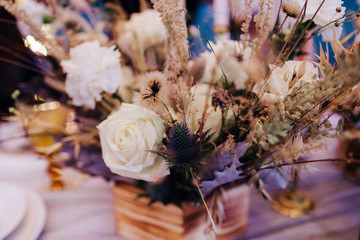 Wedding asymmetrical stylish bouquet with roses.- Image