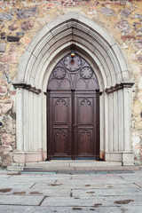 Fototapeta na wymiar Gothic architecture, wooden, antique door with a pattern