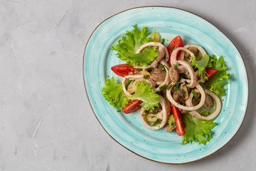 Salad of squid, mushrooms, and vegetables. The view from the top. Copy-space.