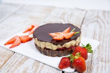 cake with strawberries, nuts and chocolate