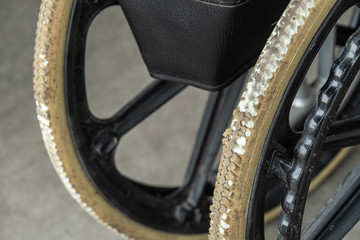 Degenerate flat-free tires of old wheelchair. Wheelchair tyres get worn out with time.