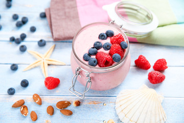 Ice cream with berries, raspberry and blueberry in glass jar