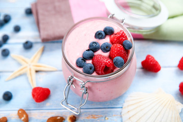 Ice cream with berries, raspberry and blueberry in glass jar