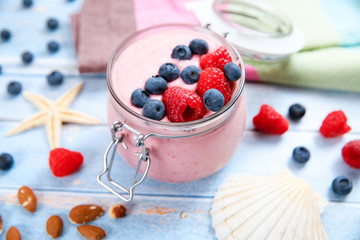Ice cream with berries, raspberry and blueberry in glass jar