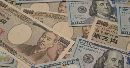 Stack of Japanese and USD