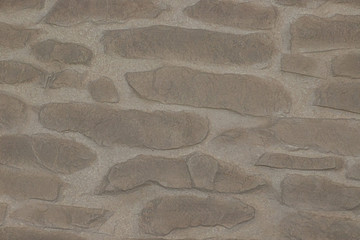 The texture of natural stone is made like brickwork. It has beautiful shades and shapes of stone.