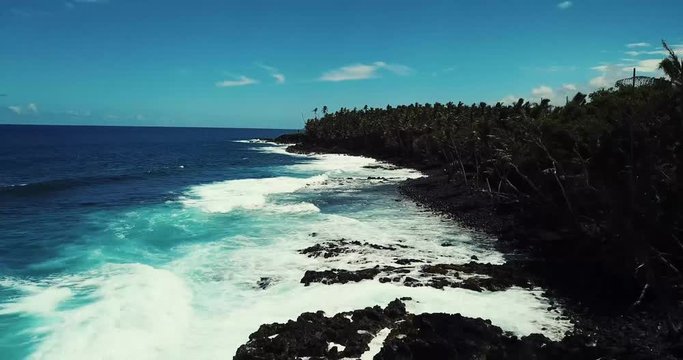 Black Sand Beach at Isaac Hale Beach Park (Pohoiki) on Big Island of Hawaii - Aerial View Along Coast. 4k.