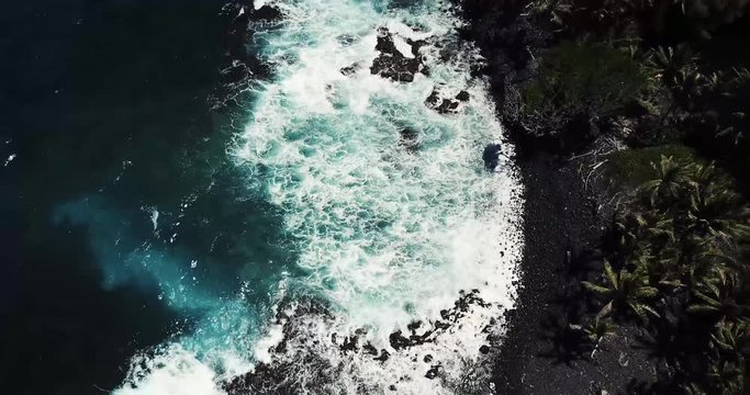Black Sand Beach at Isaac Hale Beach Park (Pohoiki) on Big Island of Hawaii - Aerial View Ascending. 4k.