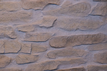 The texture of natural stone is made like brickwork. It has beautiful shades and shapes of stone.