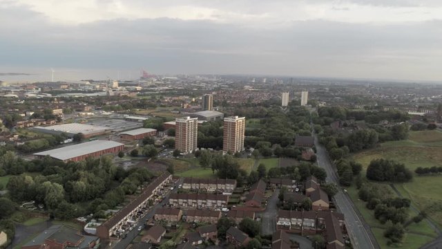 Everton valley cityscape residential property & shipyard coastline in the distance. Aerial pull back view above estate.
