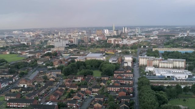 Everton valley cityscape residential property & shipyard coastline in the distance. Aerial dolly left across housing.