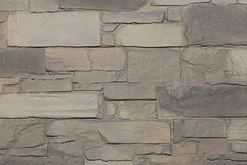 The texture of natural stone is made like brickwork. It has beautiful shades and shapes of stone.