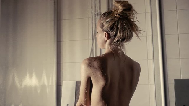 Pretty women enjoys hot shower and Finnish Sauna and Spa 4k