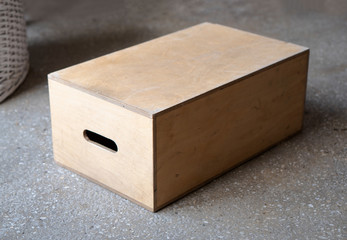 Apple boxes are wooden boxes with holes on each  in film production.