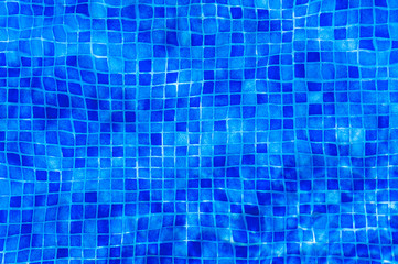 blue abstract background. Clear blue water in a Swimming Pool. With interesting through the...