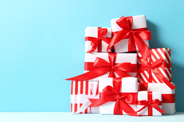 Set of beautifully wrapped gift boxes on a colored background 