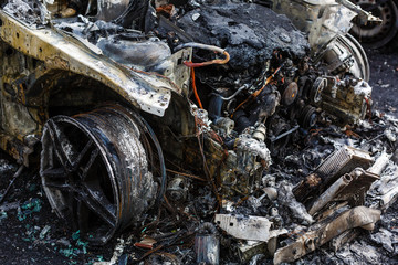Body of the burnt car in the street