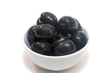 Black olives in a plate isolated