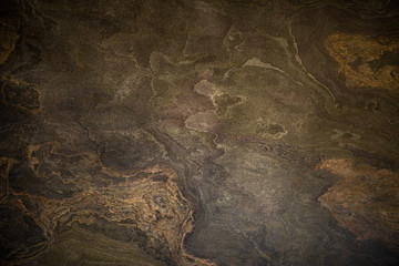 The texture of natural stone with a beautiful pattern and an unusual shade