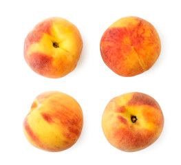 Set of ripe peaches on a white. The view of the top.