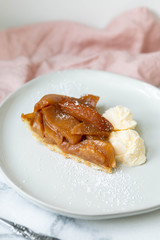 Slice of Caramel Apple Tart with Scoops of Vanilla Ice Cream