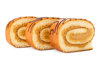 Pieces of biscuit roll close-up on a white. Isolated.