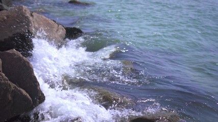 Sea surf. The waves hit the rocks. Sea coast. Splashing water.