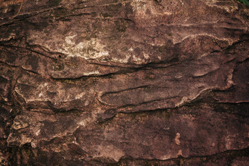 Brown stone surface or stone texture as background