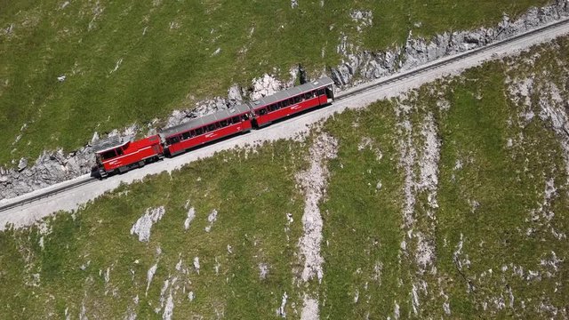 Rack railway train climbing to Schafberg summit in Salzkammergut, Upper Austria.