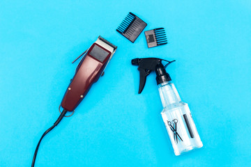 machine for a hairstyle. Barbershop. Hair clippers isolated on blue background. The machine for a hairstyle. Hair clippers isolated on  blue background