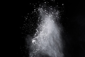 White powder explosion on black background. 
