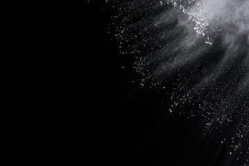White powder explosion on black background. 