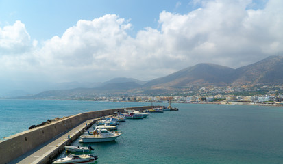 Fototapeta na wymiar View at Harbor of Hersonissos,Crete, Greece