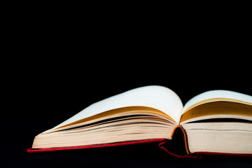 Open book isolated on a black background